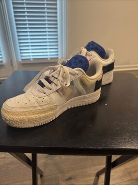 Nike Kids White Sneakers with Blue Tongue and Black Heel Accent